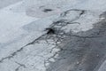 Secveral pot holes in the asphalt road in need of maintenance Royalty Free Stock Photo