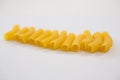 Sedani rigati pasta on white background Royalty Free Stock Photo