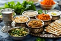 Seder dinner table with decorations, wine and food. Traditional Jewish kosher meals