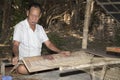 People weaving sedge grass mats.