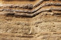 Geological layers of earth - layered rock. Close-up of sedimentary rock in Iceland. Royalty Free Stock Photo