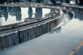 Sedimentation round tank in modern sewage or wastewater treatment plant, blue toned