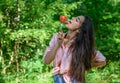 Seductive appetite. Girl holds fork with juicy ripe tomato. Girl adores ripe tomatoes. Girl seductive eats red vegetable