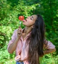 Seductive appetite. Woman full of desire eating tomato. Girl holds fork with juicy ripe tomato. Girl adores ripe