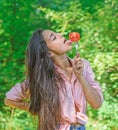 Seductive appetite. Woman full of desire eating tomato. Girl holds fork with juicy ripe tomato. Girl adores ripe