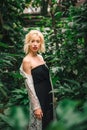 Seductive blonde female model at the rainforest