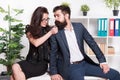 Seductive colleague. Flirting with boss. Man and woman business colleagues. Office flirt. Career company. Office couple Royalty Free Stock Photo