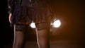 Seductive prostitute in mini dress standing on sideroad at night, sex industry