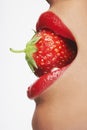 Seductive Woman Biting Strawberry Royalty Free Stock Photo