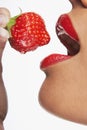 Seductive Woman Eating Strawberry Royalty Free Stock Photo