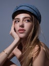 Seductive woman face. Sensual young woman posing in fashion cap hat. Beautiful sexy model. Beauty face. Sensual girl Royalty Free Stock Photo