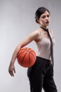 Seductive woman standing with basketball Royalty Free Stock Photo