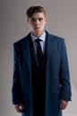 Seductive young man wears suit with coat Royalty Free Stock Photo