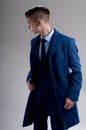 Seductive young man wears suit with coat Royalty Free Stock Photo