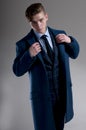 Seductive young man wears suit with coat Royalty Free Stock Photo