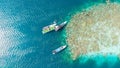 see the hustle and bustle of the port with several ships anchored