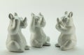 See no evil, hear no evil, speak no evil, rhino objects on white Royalty Free Stock Photo