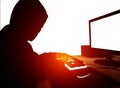 See from the side .Computer hacker working