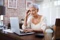 See what happens when you dont save. a senior woman looking stressed while using a laptop at home. Royalty Free Stock Photo