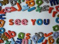 See you banner with colorful letters on one line