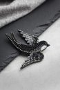Seed bead embroidered brooch in a shape of black swallow bird