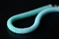 Seed bead necklace aquamarine color on a dark background Royalty Free Stock Photo