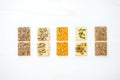 seed crackers in a row with different seeds on top