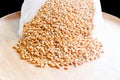 Seed Organic Wheat in a wooden dish black background 18 Royalty Free Stock Photo