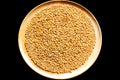 Seed Organic Wheat in a wooden dish black background 180213 0069 Royalty Free Stock Photo