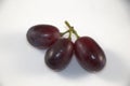 Seedless red grapes on white background Royalty Free Stock Photo