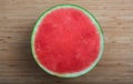 Seedless watermelon on a wooden table - top view Royalty Free Stock Photo
