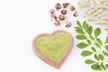 Seeds, leaves, powder and moringa capsules. Top view - Moringa oleifera