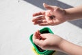 Seeds of plants and flowers in a plastic box container for seedlings with child& x27;s hand. Seeds prepared for planting in Royalty Free Stock Photo