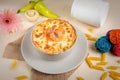 Seefood pasta with cream sauce and raw tomato in a bowl isolated on background side view