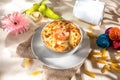 Seefood pasta with cream sauce and raw tomato in a bowl isolated on background side view