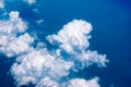 Seeing through airplane window and see overview city.Clouds in the sky and cityscapes though airplane window