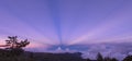 Seeing the amazing anti-crepuscular rays in the mountains. So dramatic and beautiful Royalty Free Stock Photo