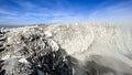 Seeing the inside of a volcano crater with smoke in east Java, Indonesia. Aerial view of volcano crater Mount Sindoro. West Java,