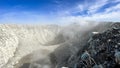 Seeing the inside of a volcano crater with smoke in east Java, Indonesia. Aerial view of volcano crater Mount Sindoro. West Java,