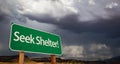 Seek Shelter Green Road Sign and Stormy Clouds