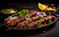 Seekh Kebab Plated on Dark Background with Garnish Royalty Free Stock Photo