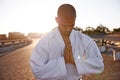 Seeking serenity. A meditative young karate practitioner wearing a gi.