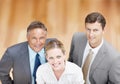 Seeking the top of the corporate pinnacle. Top-view of a trio of executives looking up at you confidently. Royalty Free Stock Photo