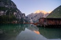 The Seekofel mountains and wooden boats reflected in the waters of Lake Braies