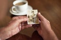 Seems like just yesterday. Cropped shot a man holding an old black and white photograph of a married couple. Royalty Free Stock Photo