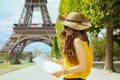 Elegant traveller woman with map having excursion Royalty Free Stock Photo