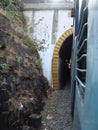 Seen of train running between stone mountains and going out from tunnel Royalty Free Stock Photo