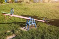 Seesaw on children playground. Outdoors games for kids. Summer day Royalty Free Stock Photo