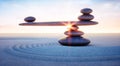 Seesaw of pebbles in the sand at sunrise or sunset