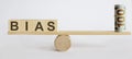 Seesaw Showing Balance Between money And word BIAS Royalty Free Stock Photo